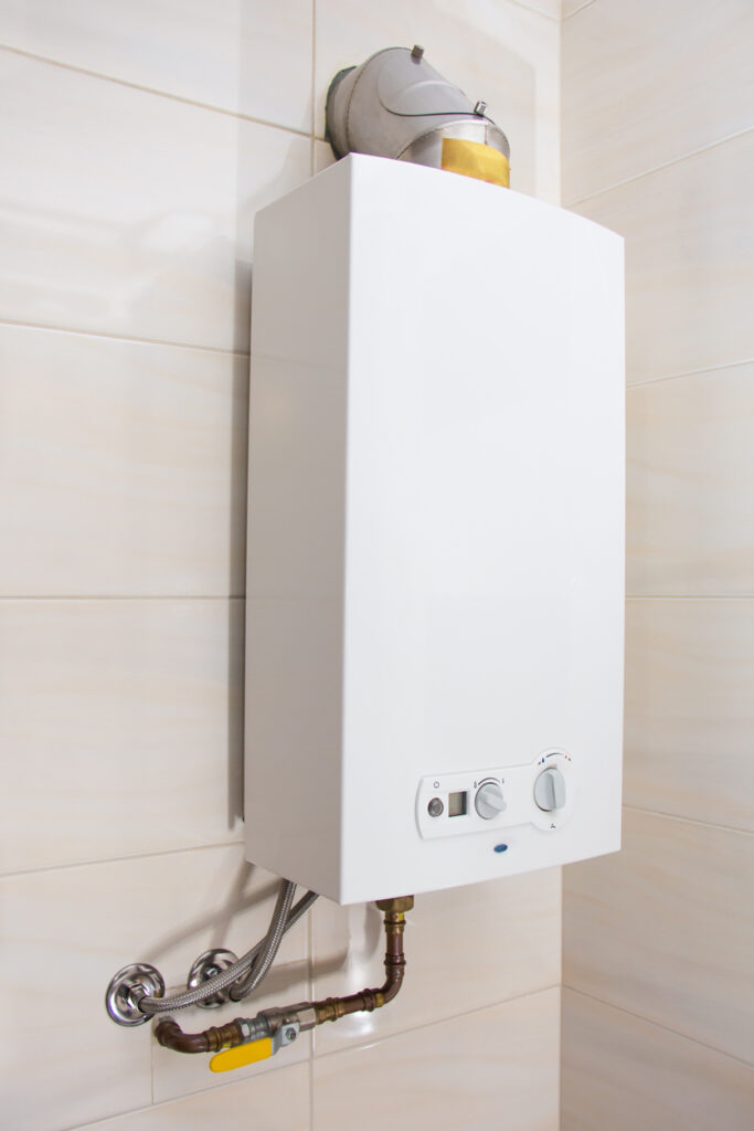 white wall-mounted tankless water heater
