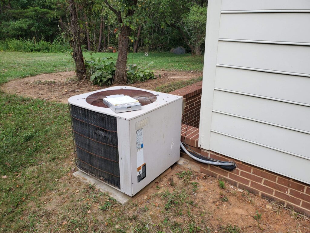 Old AC unit outside home